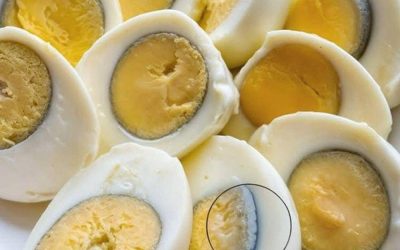 Why does a green ring appear around hard-boiled eggs?