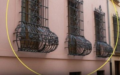Why are some window bars curved at the bottom