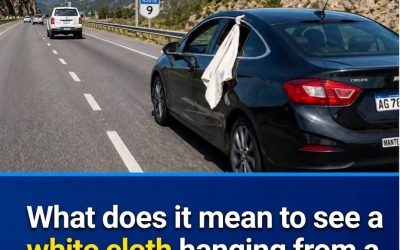 White cloth hanging from a car window: what this informal road signal means