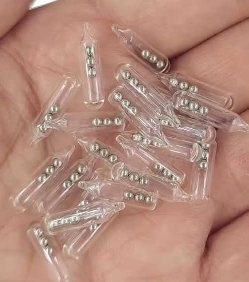Identifying Small Glass Tubes Containing Three Tiny Ball Bearings