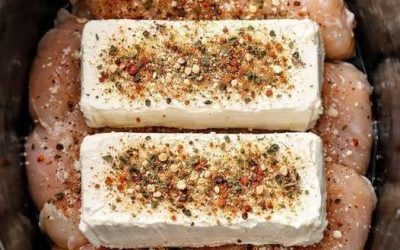 Put raw chicken breasts in the crock pot, top with blocks of cream cheese